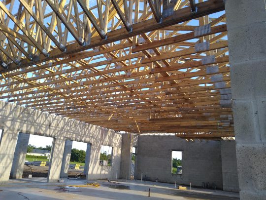 An open roof is shown with exposed trusses